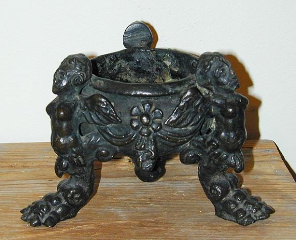 17th century Italian bronze three footed inkwell with winged angels.