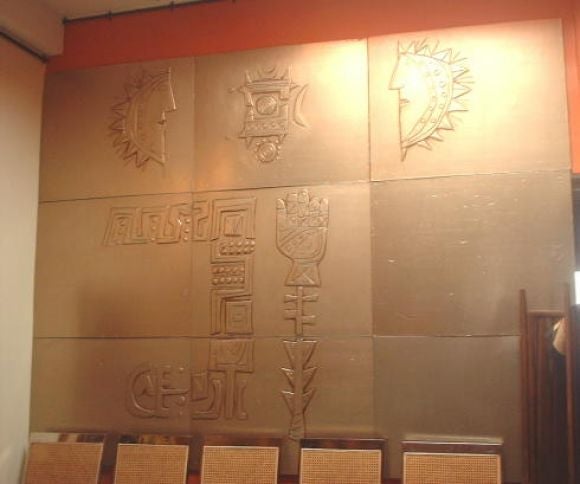 Nine High relief embossed metalsculptured  panels,over wood and gesso,composing a mithological,abstract scene,created and executed by the Italian living artist Emanuele Luzzati(born genova  1921).<br />
Executed for the Vessel 