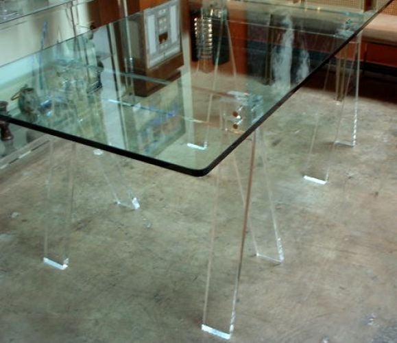 a desk/table  glass top and lucite bases in the shape of saw horse<br />
ACTUAL SIZE OF VINTAGE GLASS TOP IS 4FEETX7.5 FEET<br />
THIS ITEM IS ON SALE FOR 1,200.00