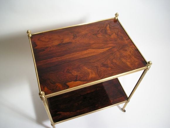 A Regency brass-bound rosewood two-tier etagere on casters.