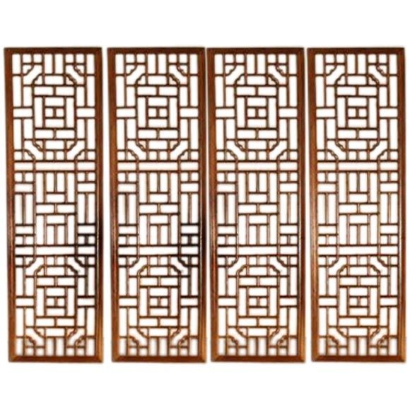 A Set Of Four Window Panels With Lattice Fret Work