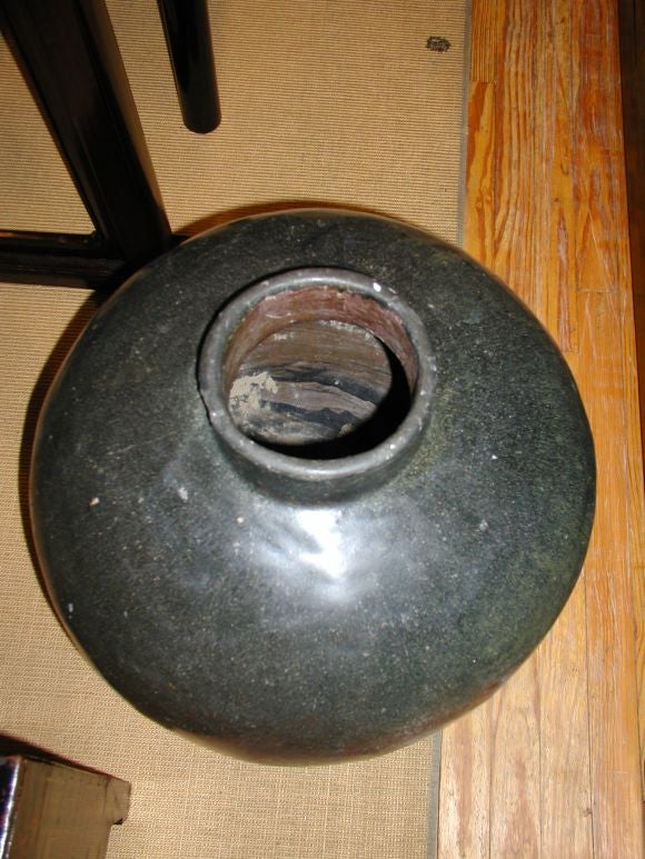 A large black ceramic wine jar, beautiful form and lines, 20