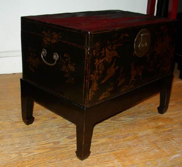 Black lacquer Trunk w. gold gilt motif