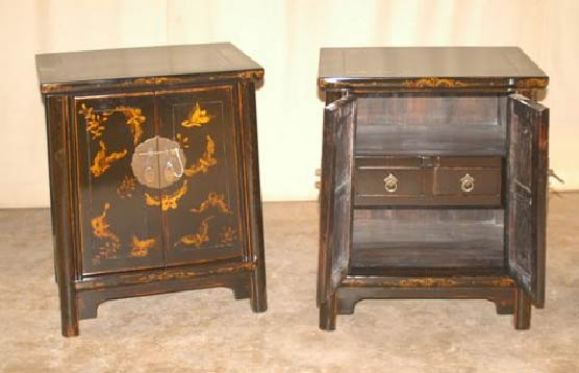 A Pair Of Black Lacquer Chests With Gold Gilt Motif