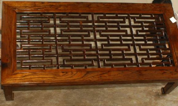 A simple and elegant ju mu wood rectangular low table with framed lattice fret work top. Beautiful form, lines and color. View our website at: www. greenwichorientalantiques.com for additional 