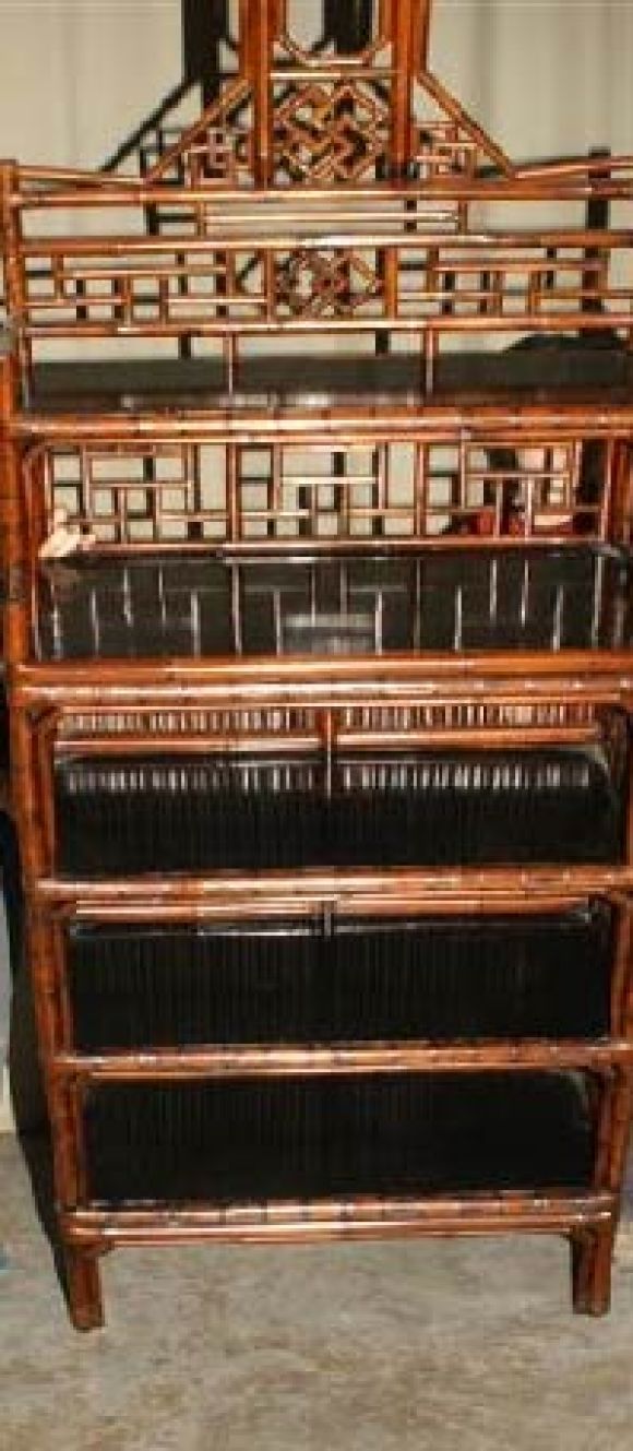 A very elegant bamboo display case with black lacquer shelves, fine geometric lattice fret work. View our website at: www.greenwichorientalantiques.com for additional selections.
