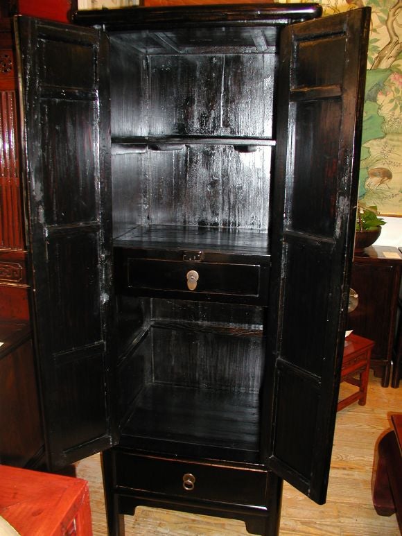 A Slender Black Lacquer Armoire