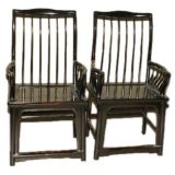 A Pair Of Black Lacquer Comb Back Armchairs