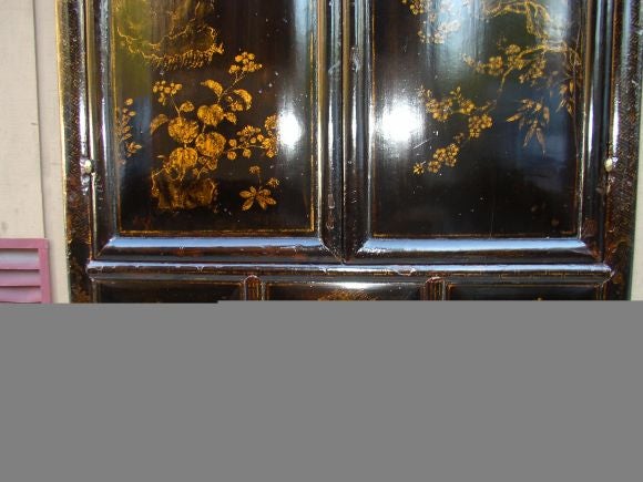 Chinese A Black Lacquer Armoire With Gold Gilt Motif
