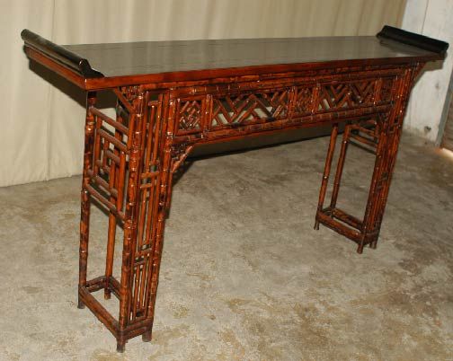 A very refined and elegant bamboo altar table, black lacquer top ended in everted flanges, fine geometric lattice fret work. View our website at: www.greenwichorientalantiques.com for additional altar table selections.