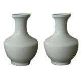 A Pair Of White Porcelain Vases With Under Gaze Floral Motif