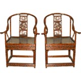 A Pair Of Bamboo Armchairs With Black Lacquer Seats