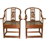 A Pair Of Bamboo Armchairs With Black Lacquer Seats