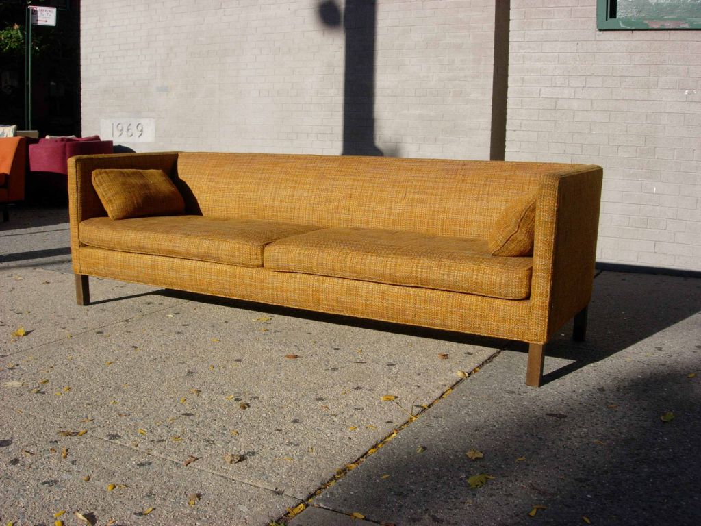 Classic and timeless Edward Wormley for Dunbar tuxedo style sofa in all original condition with wooven Dunbar fabric and decking.  Solid bleached mahoghany parsons base, with original down filled loose end pillows.  Fabric is is in good shape and