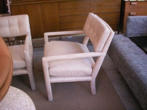 Pair of Milo Baughman parsons chairs with tufted back upholstered in ultra suede.
