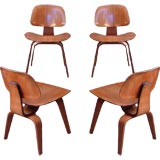 Pair of Charles Eames for Herman Miller walnut DCW chairs
