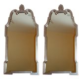 A Magnificent pair of hand carved silver finnished mirrors.