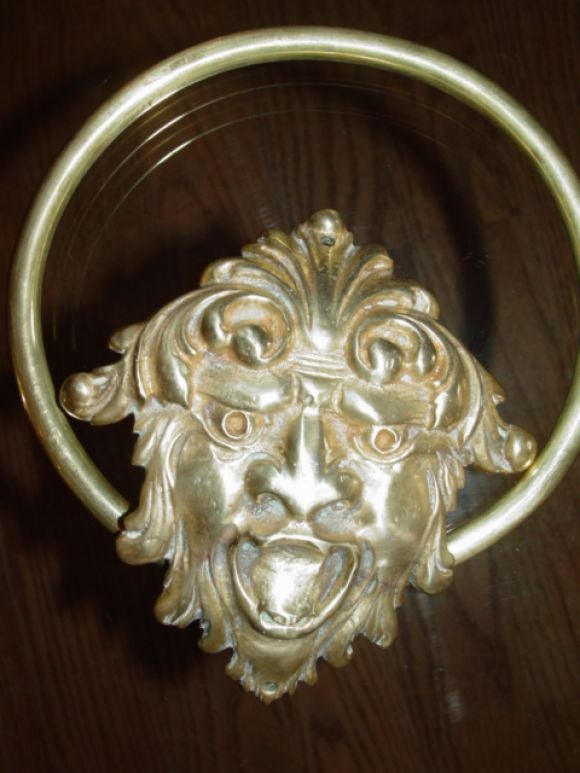 Pair of  Cast Brass towel holders, "Grotesque  Masks"
