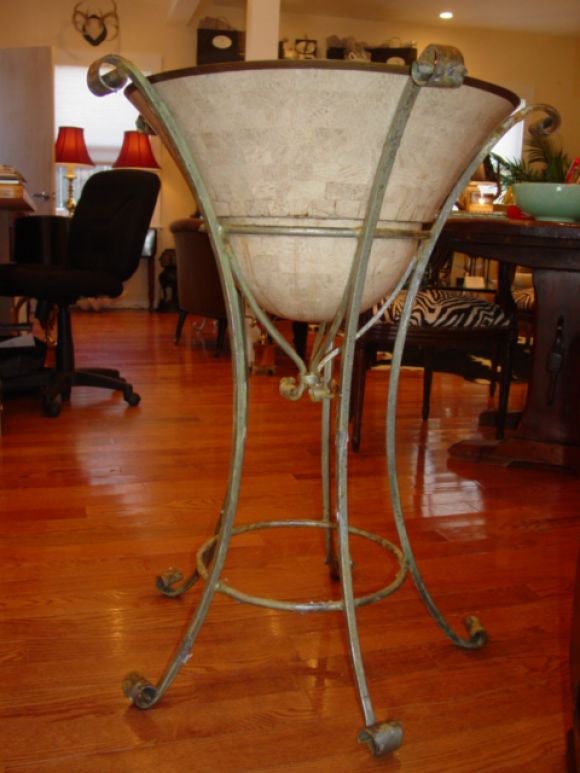 Large Iron and Bone plant stand.The bowl part is made up of small bone chips and has a metal liner inside.The stand is cast iron /patina commensurate to age.