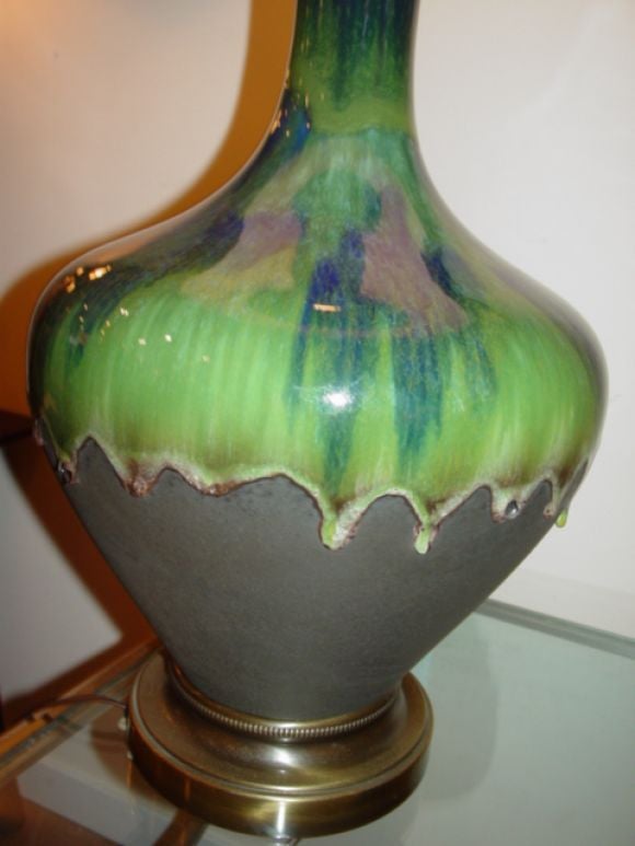 Large ceramic and metal drip glaze lamp,in shades of blue/greens.With drip edging around the middle over metal base.