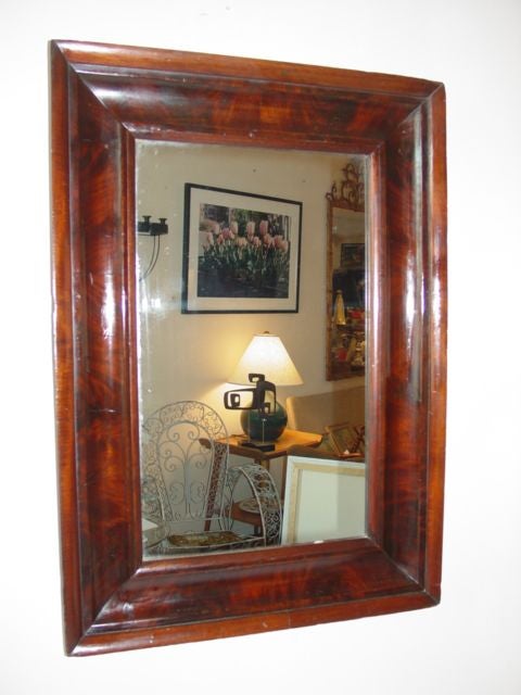 Magnificent detail in this 19th century mahogany mirror,origional backing in tact,origional glass,classic elegance.