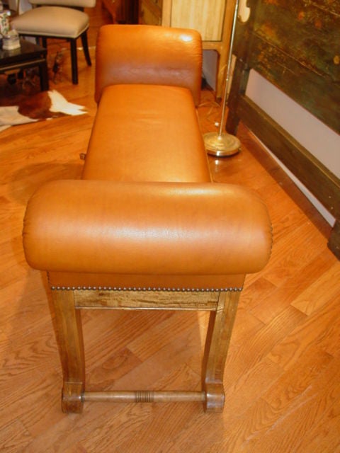 English Leather Upholstered Light Mahogany Rolled Arm Bench.