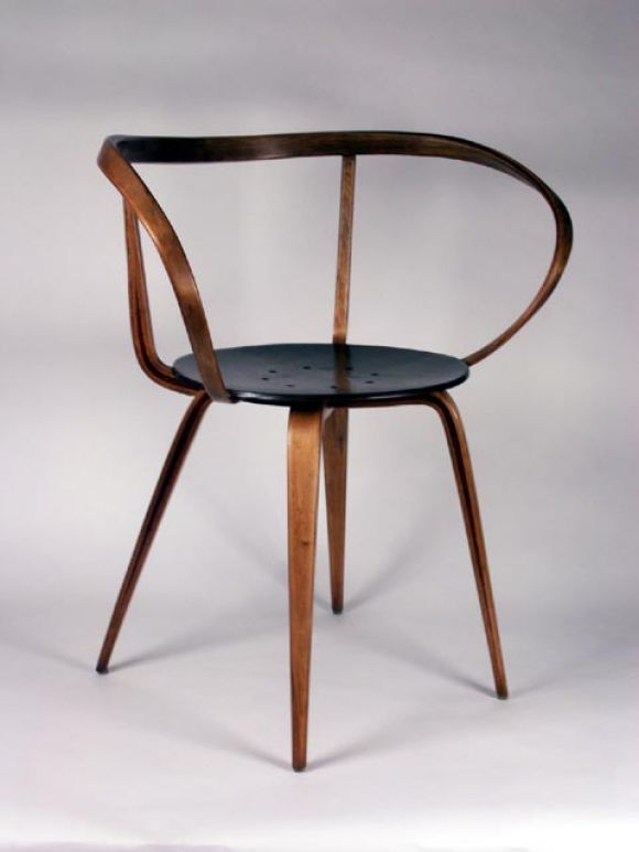 Rare design by Nelson for Herman Miller. Slender curvaceous bent wood arm rises from beneath the seat to define the armrest and seat back. Masterful use of materials later reflected in Norman Churner's mass market design.