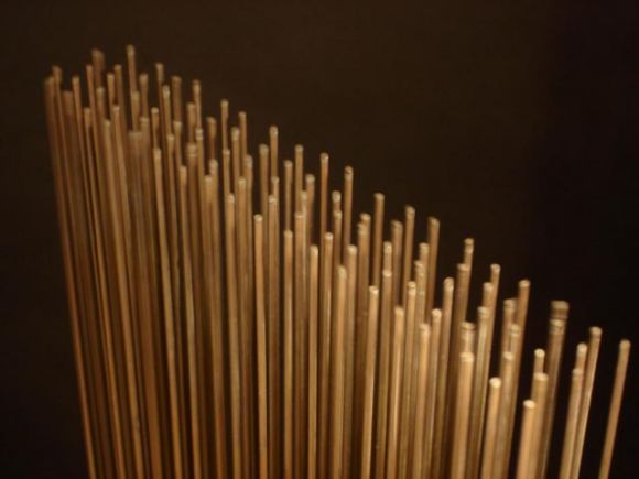 Bertoia's most desirable sculpture style, executed with Berilium copper rods, mounted to a bronze base. 5 rows of slender closely spaced rods, make for a resonating shimmery tone.