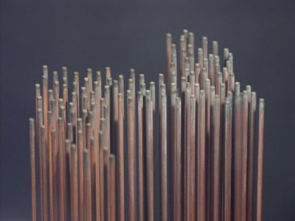 An early example of Bertoia's celebrated tonal sculpture. Unusual configuration of over 100 slender copper rods, in a wide zig zag. It features a lovely dark patina, with a shimmering ethereal tone. Given to his wife by Bertoia, it was acquired