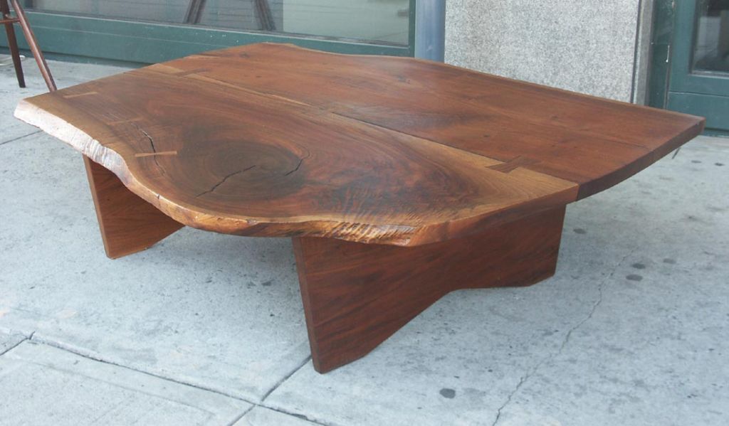 Gino Russo, an employee of George Nakashima, trained in Italy, and worked for Nakashima starting in 1955, simultaneously producing furniture for clients who could not bear the long waiting time. This large coffee table, bears several Nakashima