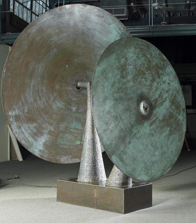 A true masterwork by Harry Bertoia, executed in 1976. Created along with a suite of work for the grand opening of the Grieg Concert Hall in Bergen. Norway. A pair of enormous round gongs, 6 and 8 feet in diameter, suspended on a twin prong base. a