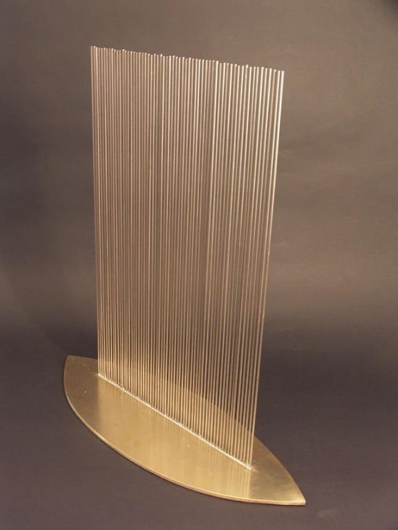 Fantastic shimmering waves of sound produced by this sonambient by Val Bertoia. An oval of polished bronze, is pierced with thin rods of monel, the weight of the base steadies the active motion of the rods for great sustain.