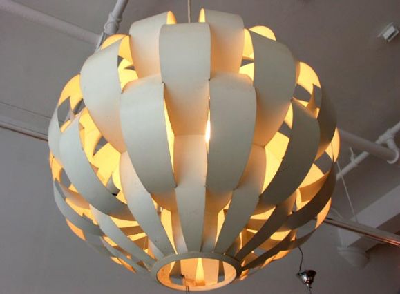 stunning chandelier by Lightolier 1960's. Bent and folded steel ribbons radiate around the internal light source, creating a beatiful light.