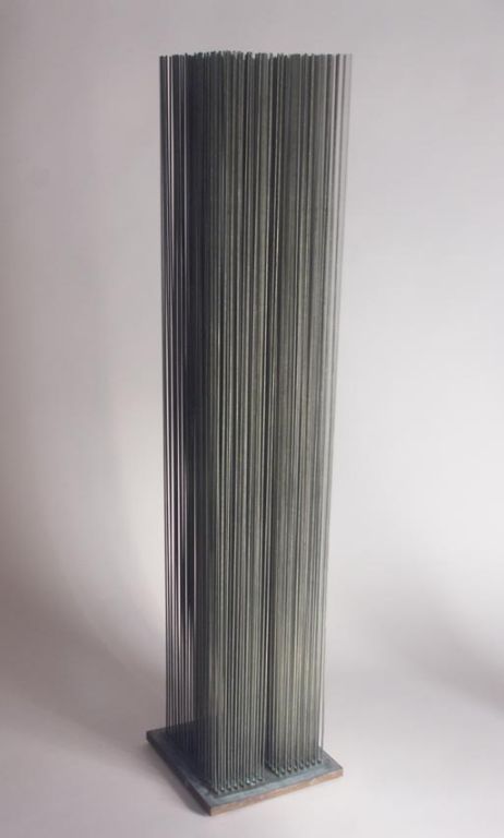 An unusually dense example of Bertoia's sounding work. Four equal quadrants of 64 rods, 256 in total, are mounted to the thick bronze base. The rods in nickel bronze, are arranged in perfect grids of 8 x 8, creating a mesmerizing effect in motion,