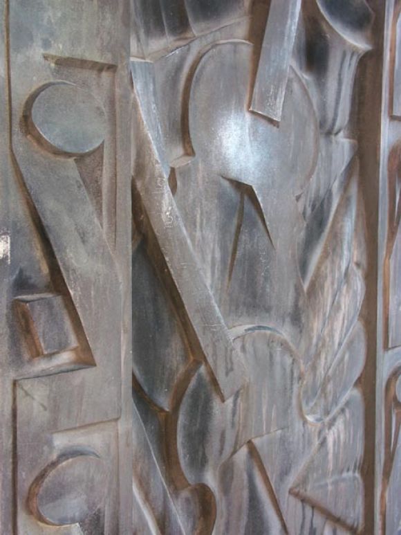 Designed by Lawrence Emmons, The Barbizon Hotel was erected in 1929. The upper floors featured large Art Deco panels depicting the arts, and music on the exterior. Deep relief cast in aluminum, this panels motif is music. The abstract design