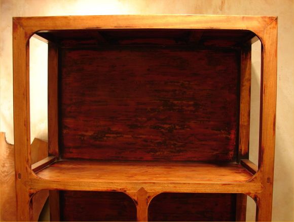 Made to exacting standards in the Ming style from reclaimed wood, these stately bookcases are perfect for displaying books and antiques. Distressed finish with traces of black and red lacquer hand rubbed. Priced for the PAIR