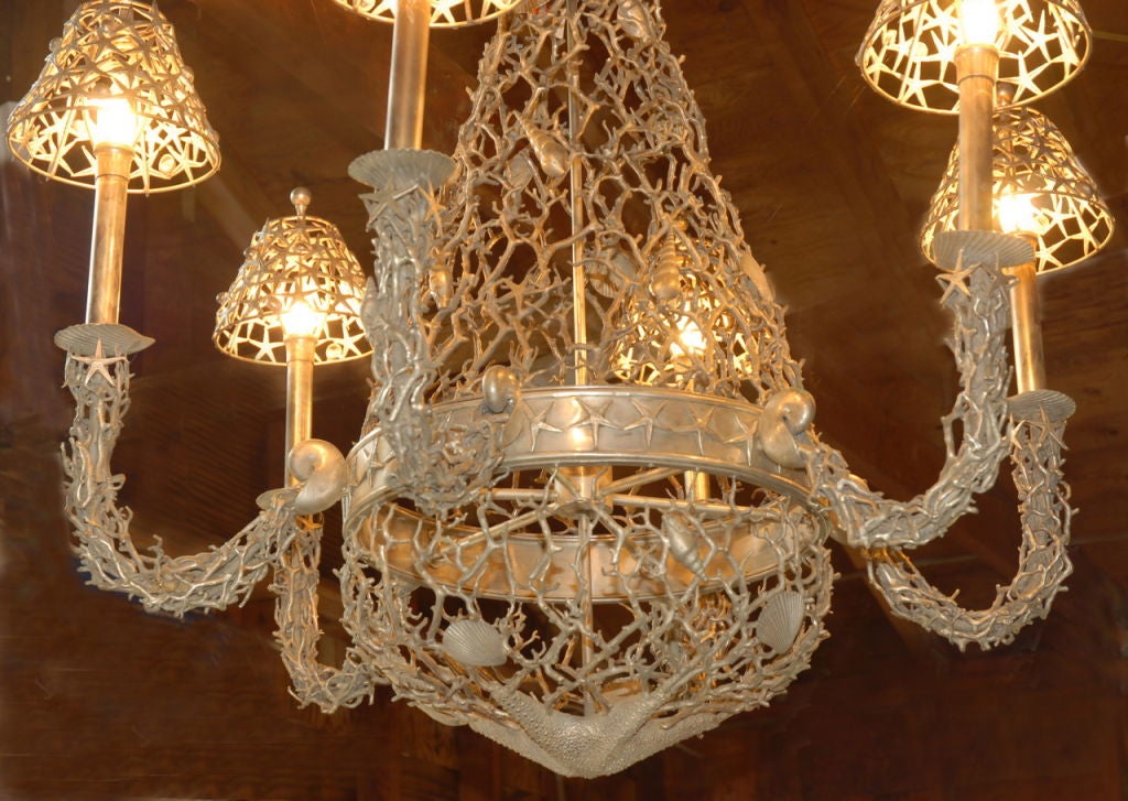 A highly ornate and unusual chandelier with a seashore theme, in silver plated metal. Shells and coral design