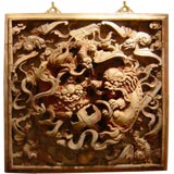a pair of window carvings