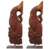 pair of dragon fish carvings