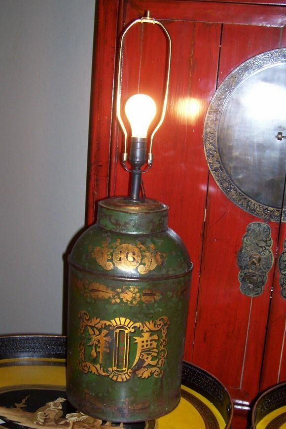Now Mounted as Lamps<br />
Each stencil decorated  in black, red and gold with Chinese characters and Arabic numbers within scrolling patterns on a green ground, now fitted as a table lamp with a black shade.