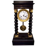 French Gilt Bronze Mounted Ebonized Portico Clock