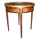 Louis XVI Style Parcel Ebonized and Gilt Mounted Marbletop Table