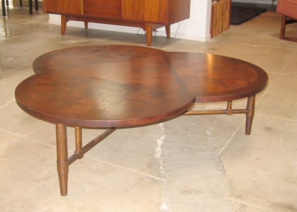 Get lucky with this handsome clover-leaf shaped coffee table.  Solid walnut with expertly inlaid patchwork top.