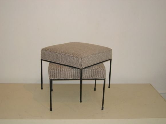 Pair of iron-framed foot stools in the style of Paul McCobb.  Re-upholstered in new Knoll fabric.