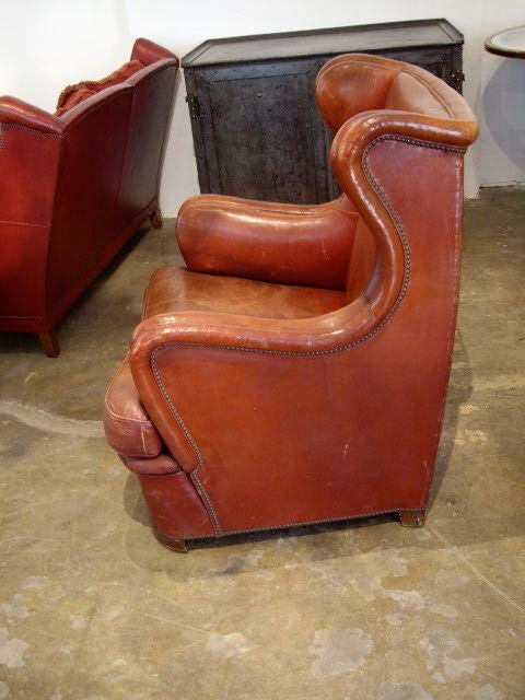 pair stylish and comfortable leather wingback chairs with original leather.