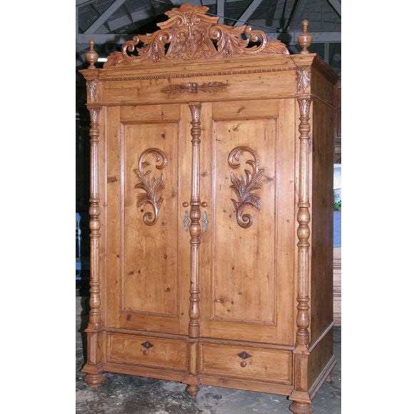 Beautifully carved details adorn this 19th century armoire. We have installed pocket doors (Accuride cable & pulley system)and interior shelving so that it can accommodate a large TV. Interior can be modified to suit any needs.