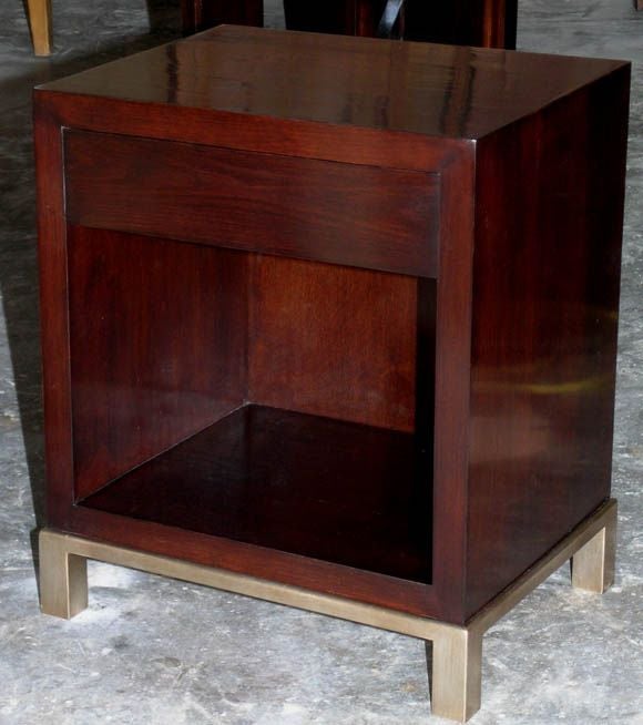 Nightstands based on 1930's Italian design in solid 8/4 walnut with premium satin finish and glazed silver leaf base. The push-to-open, push-to-close hardware is state of the art and eliminates the need for pulls.<br />
<br />
We can reproduce