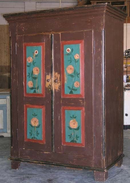 Folk art painted armoire. Interior shelving has been added to accommodate computer etc. We can customize interior for any needs.