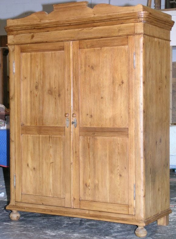 Original armoire from the Russian countryside. Without compromising the original craftsmanship of this antique cabinet, we have carefully installed shelving so that it can function as computer work station. There is space for all the components of a