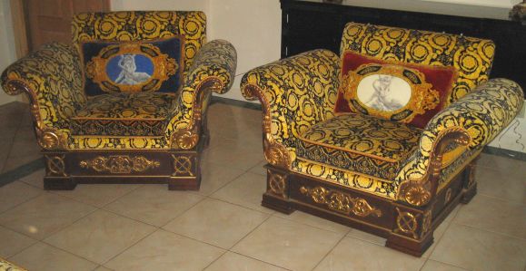 Massive 9' camelback silk velvet sofa and pair of silk velvet club chairs with carved parcel gilt bases and arms.  8 silk pillows complete the dramatic look.  Pillows and sofa signed Atelier Versace. Outstanding examples of Gianni Versace's